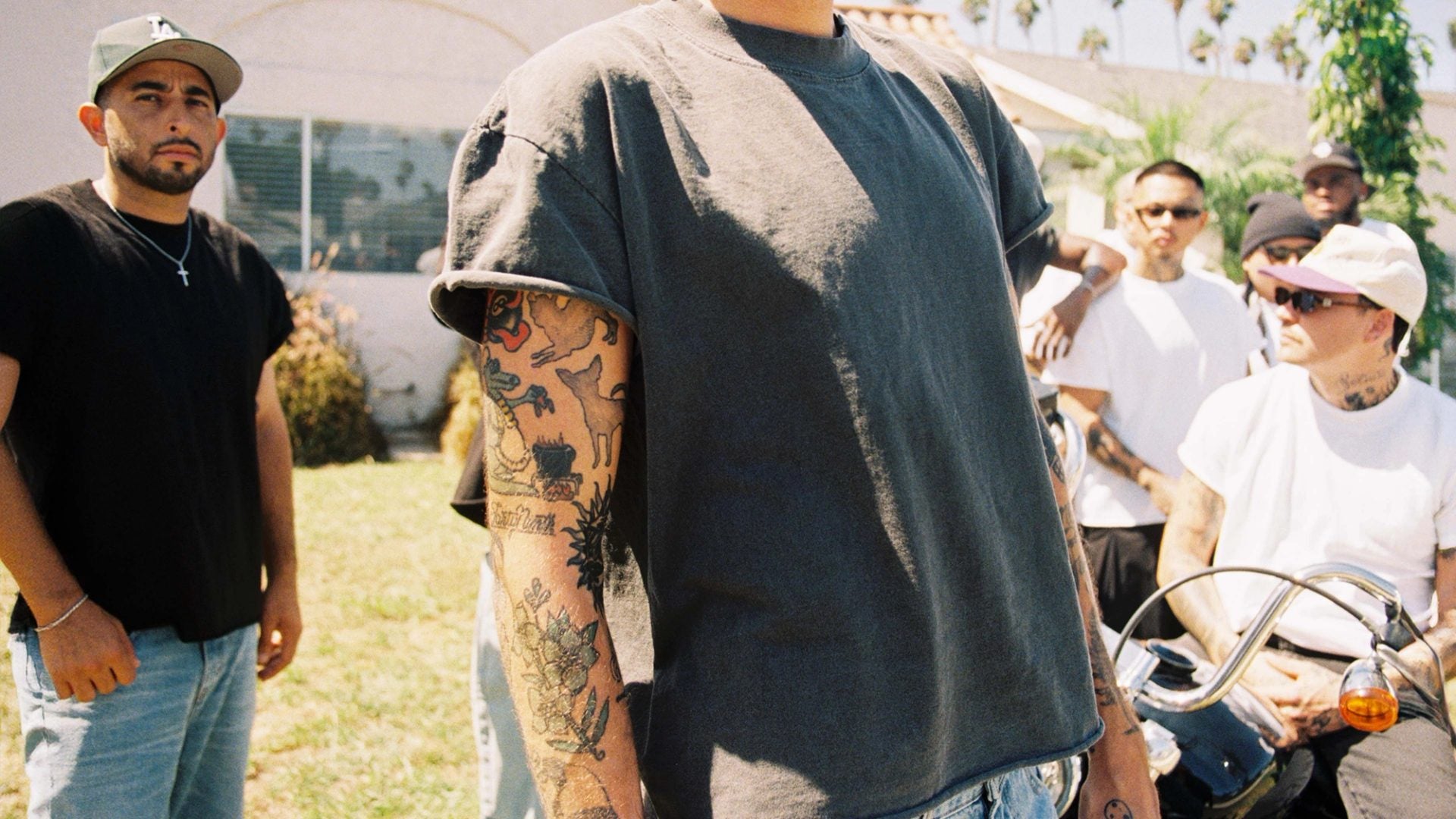 Collage of three streetwear looks: relaxed denim, an oversized white tee with baggy jeans, and checked wide-leg shorts
